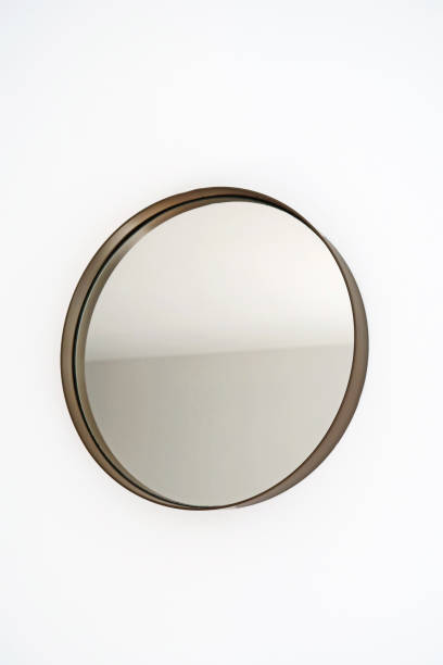 istock Round mirror on a white wall. Minimalist interior design 2115021097