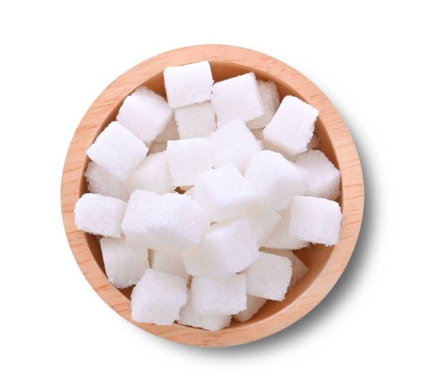 istock White sugar cubes in wooden bowl isolated on white background 2115030462