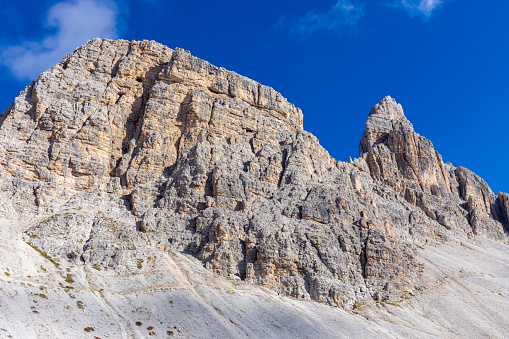 Dolomites, Dolomiti Alps in Italy beautiful mountain summer landscape with high rocky towers on the hiking route trekking around Tre Cime di Lavaredo