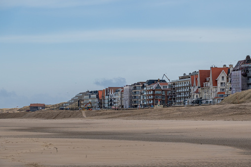 the coast at low tide with beach in the early morning of De Haan, Belgium