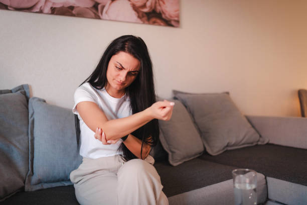 istock Young woman having elbow pain 2115071250