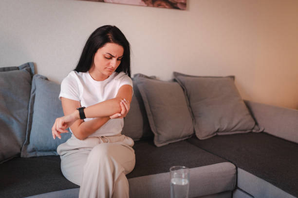 istock Young woman having elbow pain 2115071412