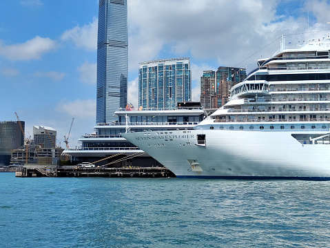 Cruise ship moored on Victoria Harbour at Ocean terminal in Hong Kong Kowloon peninsula.