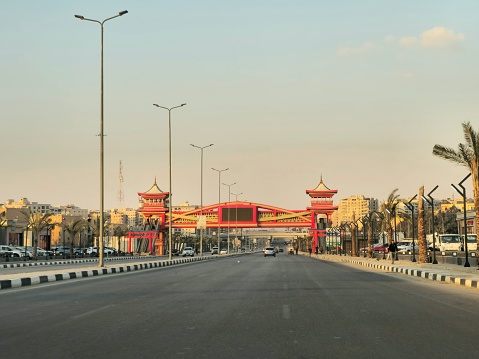 Cairo, Egypt, March 23 2024: Shinzo Abe axis patrol highway in Egypt with a pedestrian bridge finished in traditional Japanese architectural style, the traffic highway is named on former Japanese PM, selective focus