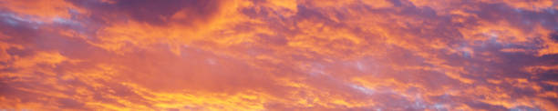 orange purple dramatic stormy sky before storm for panoramic horizontal banner
