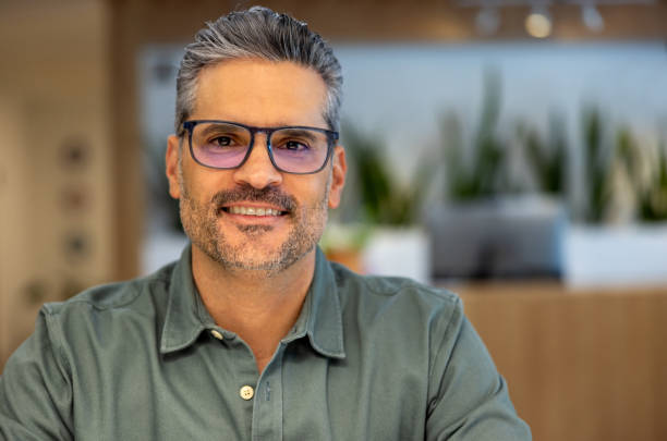istock Successful business man smiling at a coworking 2115127405