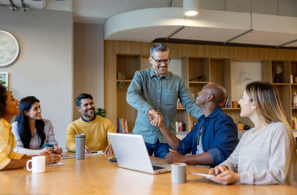 istock Businessman getting a promotion and handshaking with his boss 2115127936