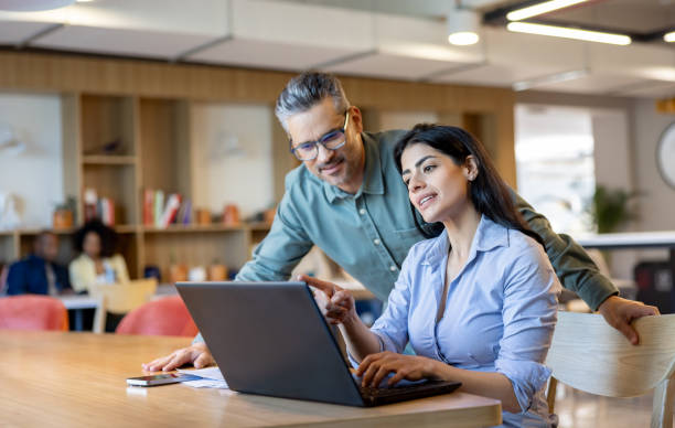 istock Business team working together at the office using a laptop computer 2115127942