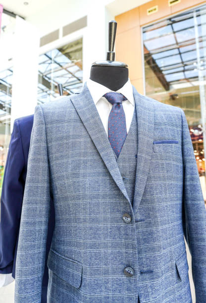 istock Male mannequin dressed in elegant suit with a tie 2115140299