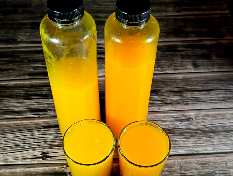 Fresh orange and mandarin tangerine juice, full of vitamins, as a refreshment of natural fruit juice, Tangerine Juice, The mandarin orange (Citrus reticulata), also known as the mandarin or mandarine, selective focus