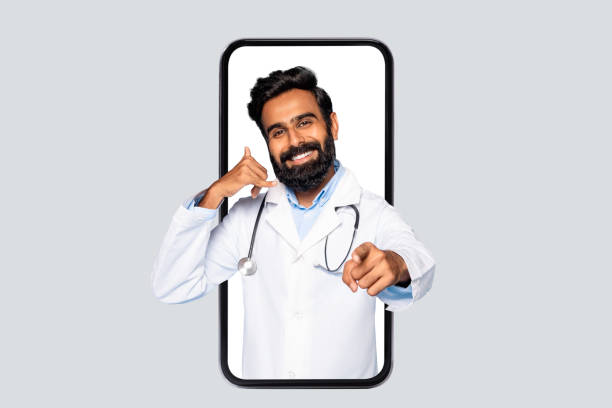 istock Indian male doctor in phone frame making call sign 2115159240