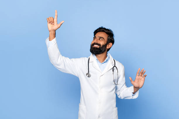 istock Male doctor touching invisible screen with happy look 2115159241