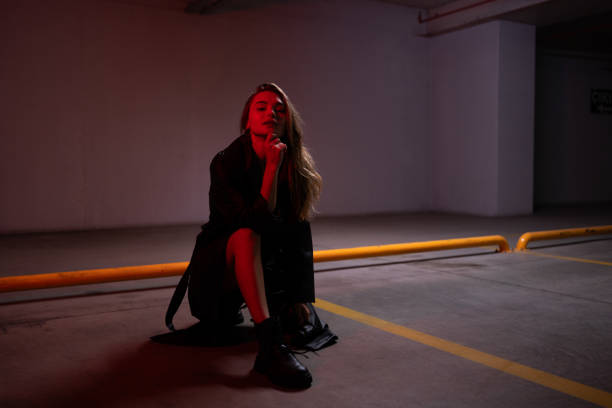 Stylish and beautiful young woman in an underground parking lot.