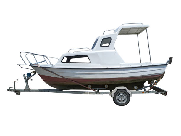 istock White motor boat on a car single axle trailer side view isolated 2115215042