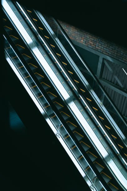 Empty escalator stairs in a dark bottom