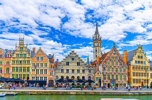 Ghent, Belgium, July 6, 2023: Cityscape of Ghent old town, Graslei Grass Quay with row of historic buildings guild houses on bank of Lys river embankment in Ghent city historic center, Flemish Region