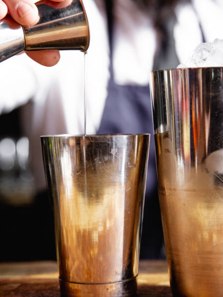 istock The bartender makes an alcoholic cocktail with ice in a bar in a special dish. 2115276970