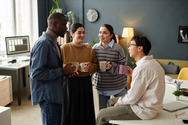 istock Adults at Coffee Break Chatting Cheerfully 2115292097