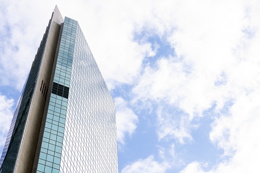 Low angle view of modern office building, Sydney, sky background with copy space, full frame horizontal composition