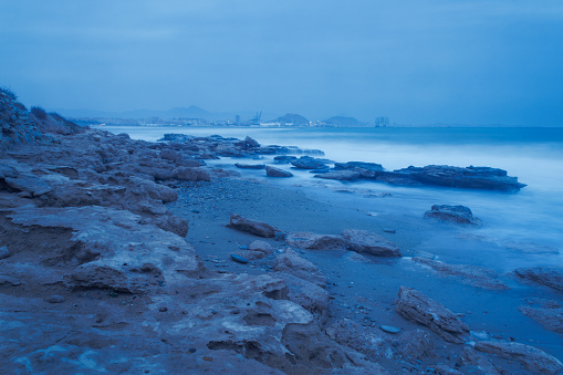 Long exposure on Agua Amar beach in Alicante during stormy weather. Spain