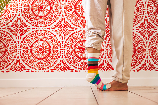 Person wearing rainbow socks during the Pride Month in the United States.