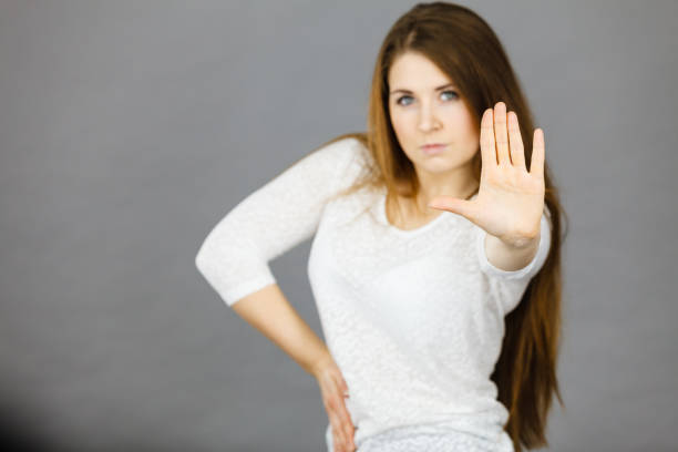 istock Angry apodicticity woman showing stop with hand 2115325415