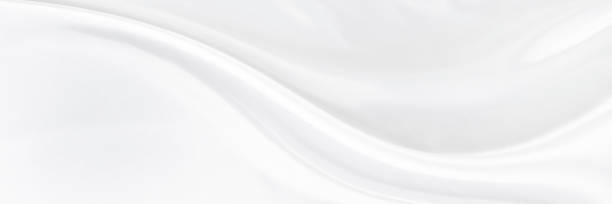 istock White gray satin texture that is white silver fabric silk panoramic background with beautiful soft blur pattern natural. 2115331718