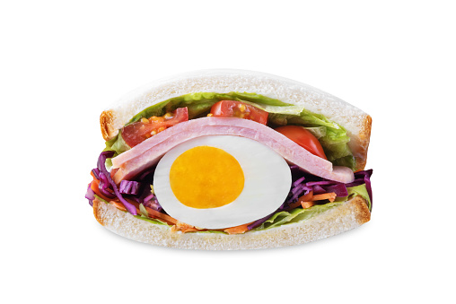 Japanese Wanpaku sandwich with egg, red cabbage and ham on a white isolated background. toning