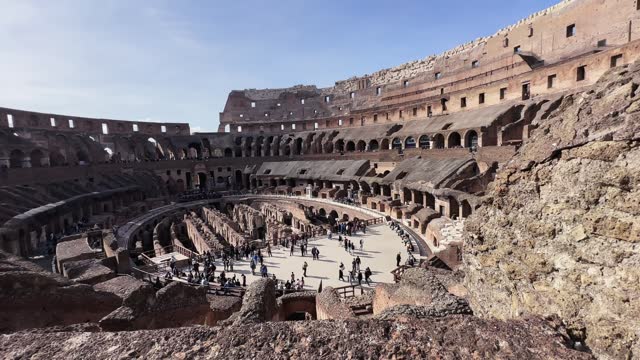 Interior view of the Colosseum an ancient amphitheater in Rome, establishment shot