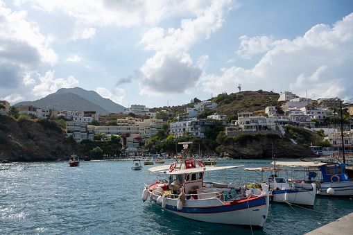 View across marina to city and mountains