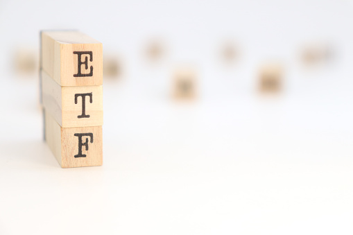 Acronym ETF (Exchange Traded Fund) isolated on wooden cubes.
