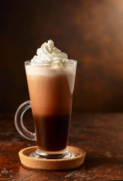 istock Hot chocolate with whipped cream in a glass mug. 2115389642