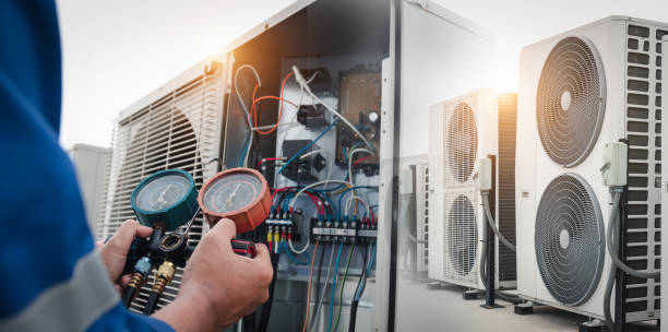 istock Technician is checking air conditioner,measuring equipment for filling air conditioners. 2115404898