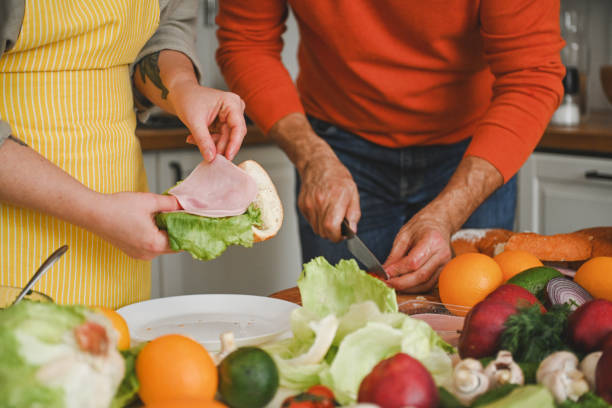 istock husband and wife cooking in the kitchen 2115423935