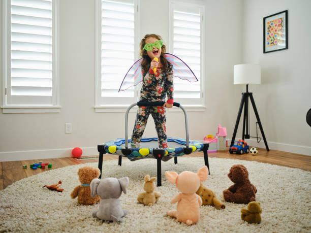 istock Preschooler Playing a Make-Believe Concert 2115434750