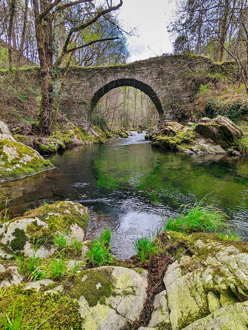 Ancient Roman bridge over the Polea river in Villayon, Asturias, Spain, Europe