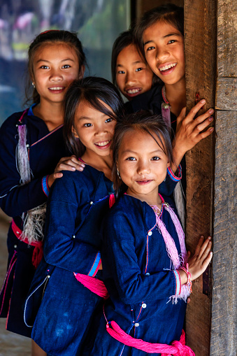 Laotian young girls, wearing traditional Lantan tribe clothes, during classes in a primary school in Lantan village in Northern Laos