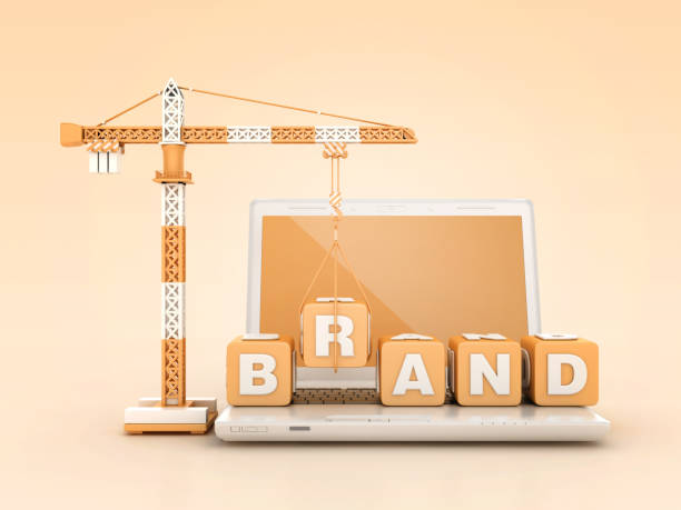 istock BRAND Blocks with Tower Crane on Computer Laptop 2115469740