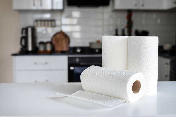 Rolls of paper towels on white marble table in kitchen