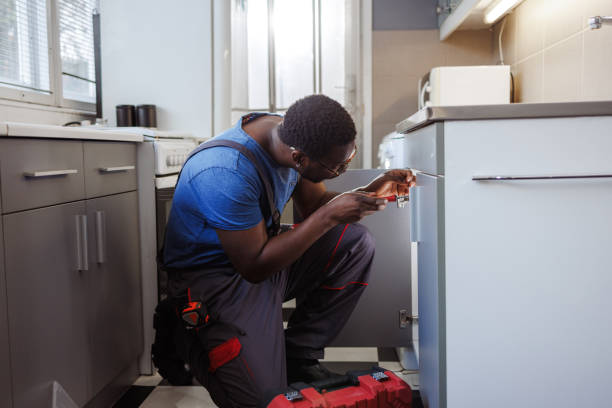 istock A handyman working in a client's house 2115502736