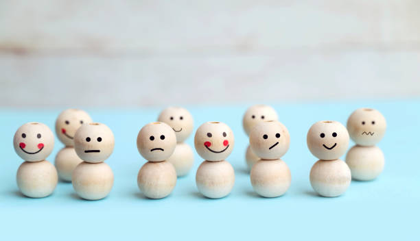 istock Wooden cubes with different emotions . Empathy concept 2115503291
