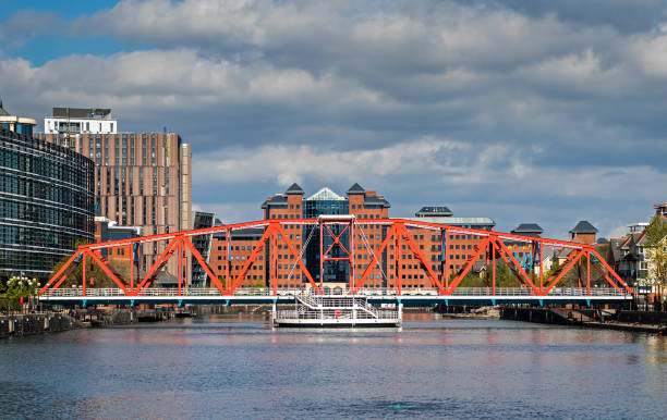 Manchester The Salford Quays Millennium Bridge in England UK United Kingdom. Former Salfor Docks in 1894. Today is Greater Manchester's unique waterfront destination in Manchester Ship Canal.