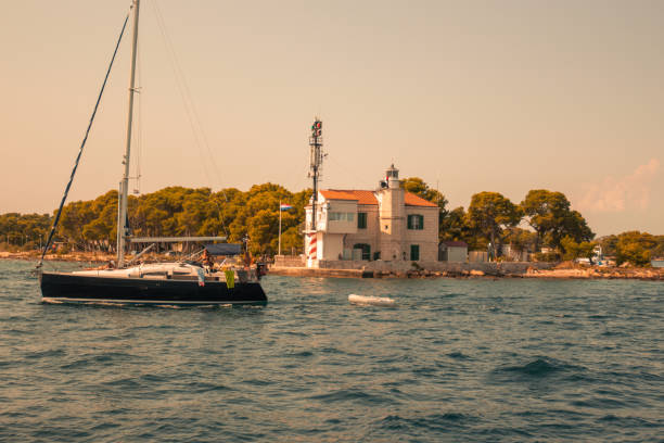 Yacht in harbour at sunset, in summer