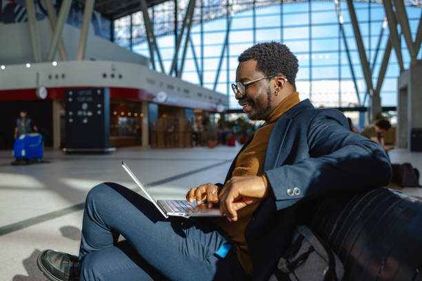 istock Elegant African American businessman using smart phone 2115525875