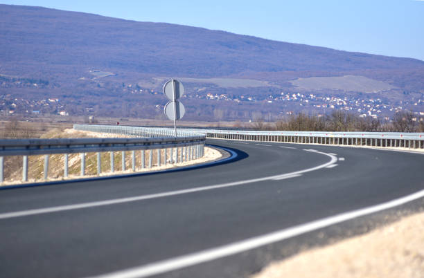 New metal guardrail standing next to the highway
