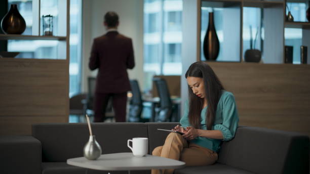 istock Woman ceo searching tablet computer in office. Busy manager looking pad data 2115547516