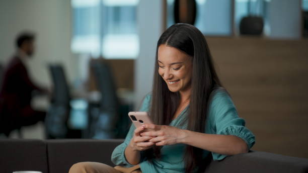 istock Gadget user laughing reading jokes at office lounge closeup. People emotions 2115576543
