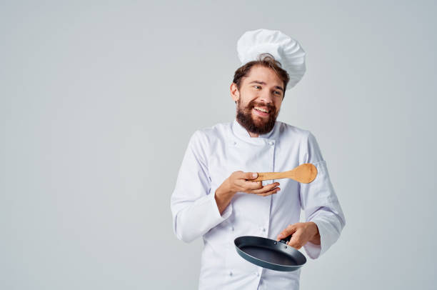 istock professional chef Frying pan in hand cooking cooking work 2115630649