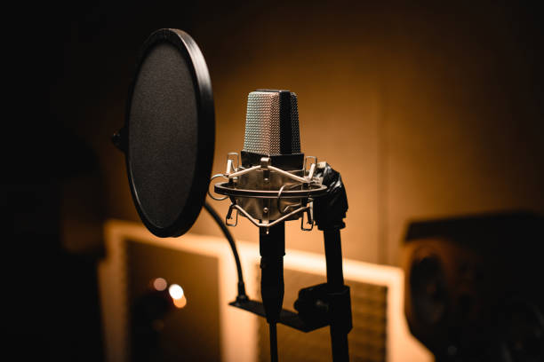 istock Close-up shot of a professional microphone in a recording studio 2115639730