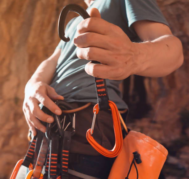 istock Man is climbing, hiking in the mountains. 2115659328